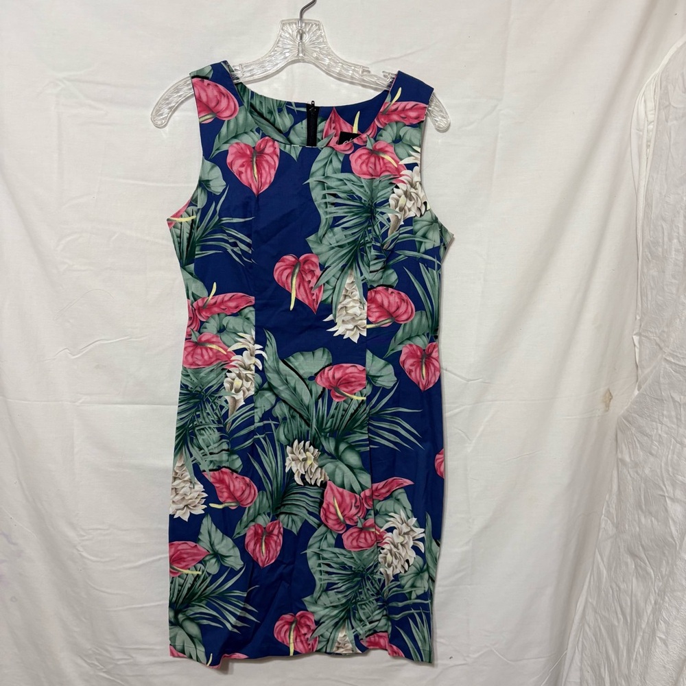 Hawaiian blue tropical print dress is a sleeveless sheath or midi style